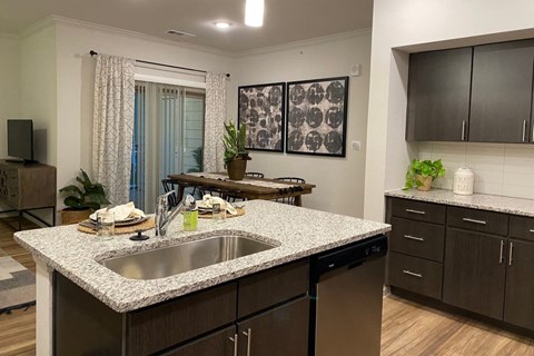 a kitchen with a granite counter top and a sink